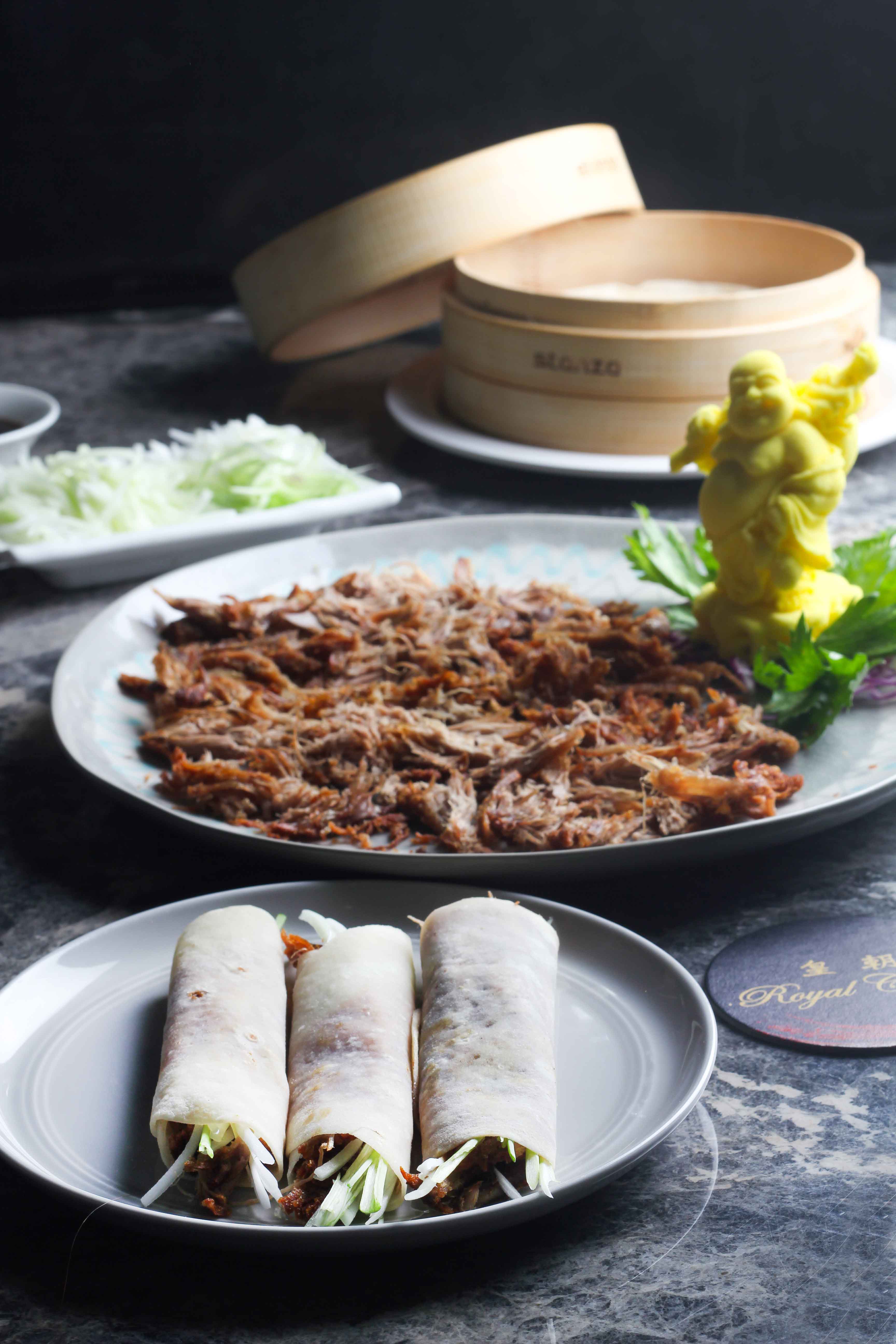 Crispy-Aromatic-Duck-served-with-spring-onion,-cucumber-and-Pan-cakes